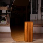 A custom-designed mirror paired with a Natural Wood base